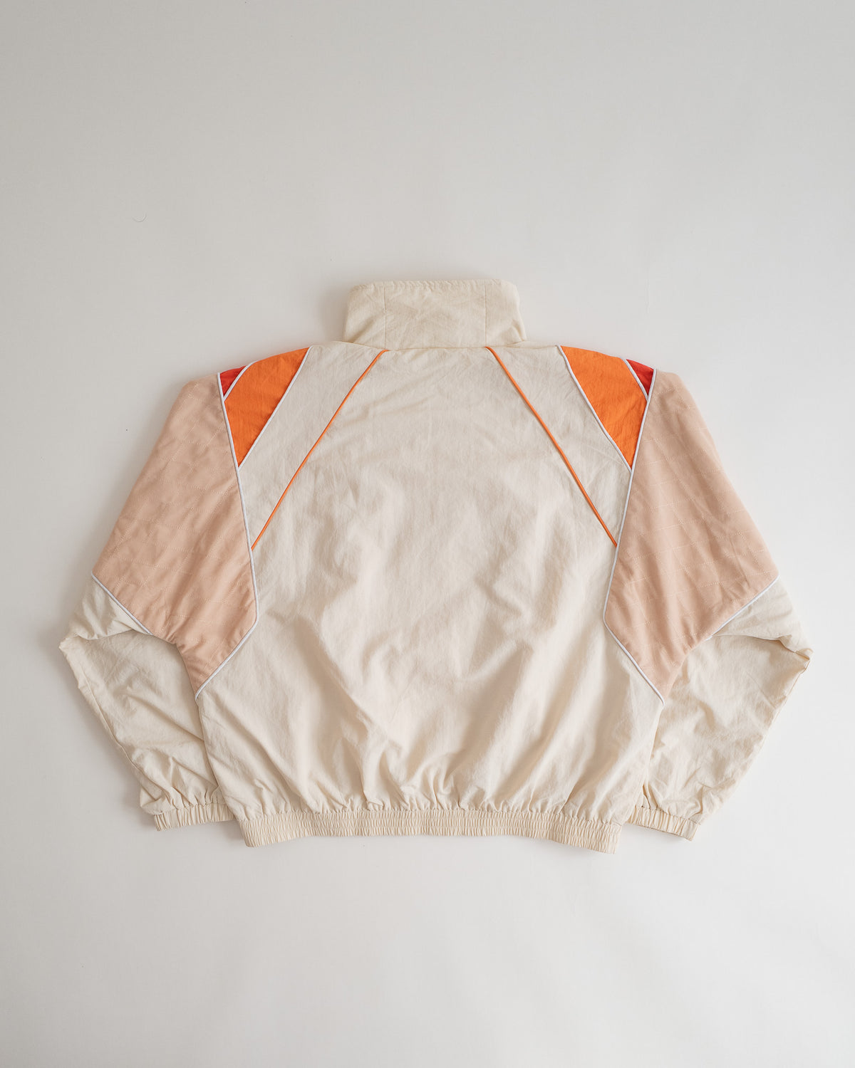 Sweets Track Jacket in Saffron Orange, flat lay from the back #Color_Saffron Orange