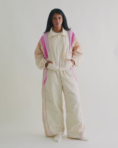 Video of a woman in the Rose Pink Sweets Track Jacket and matching Track Pants