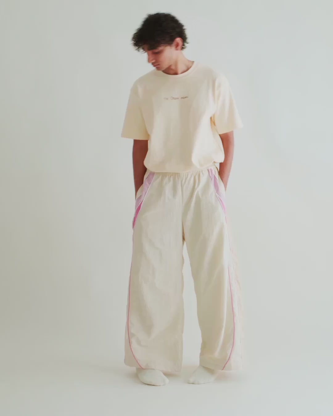 Video of a man in the Recipe Tee with the Sweets Track Pants in Rose Pink