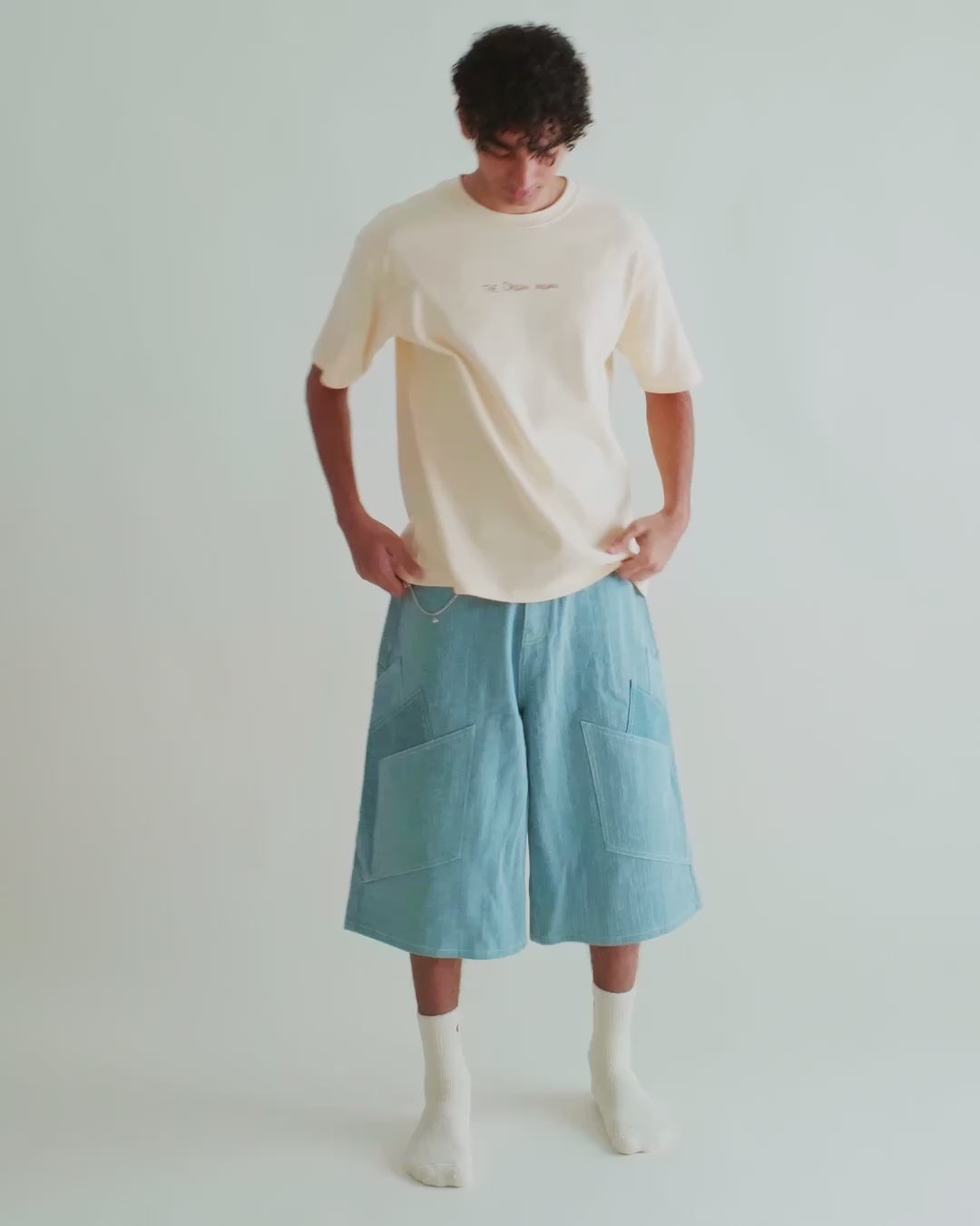Video of a man in the Recipe Tee with the Khadi Katli Jorts, watercolor print across the back