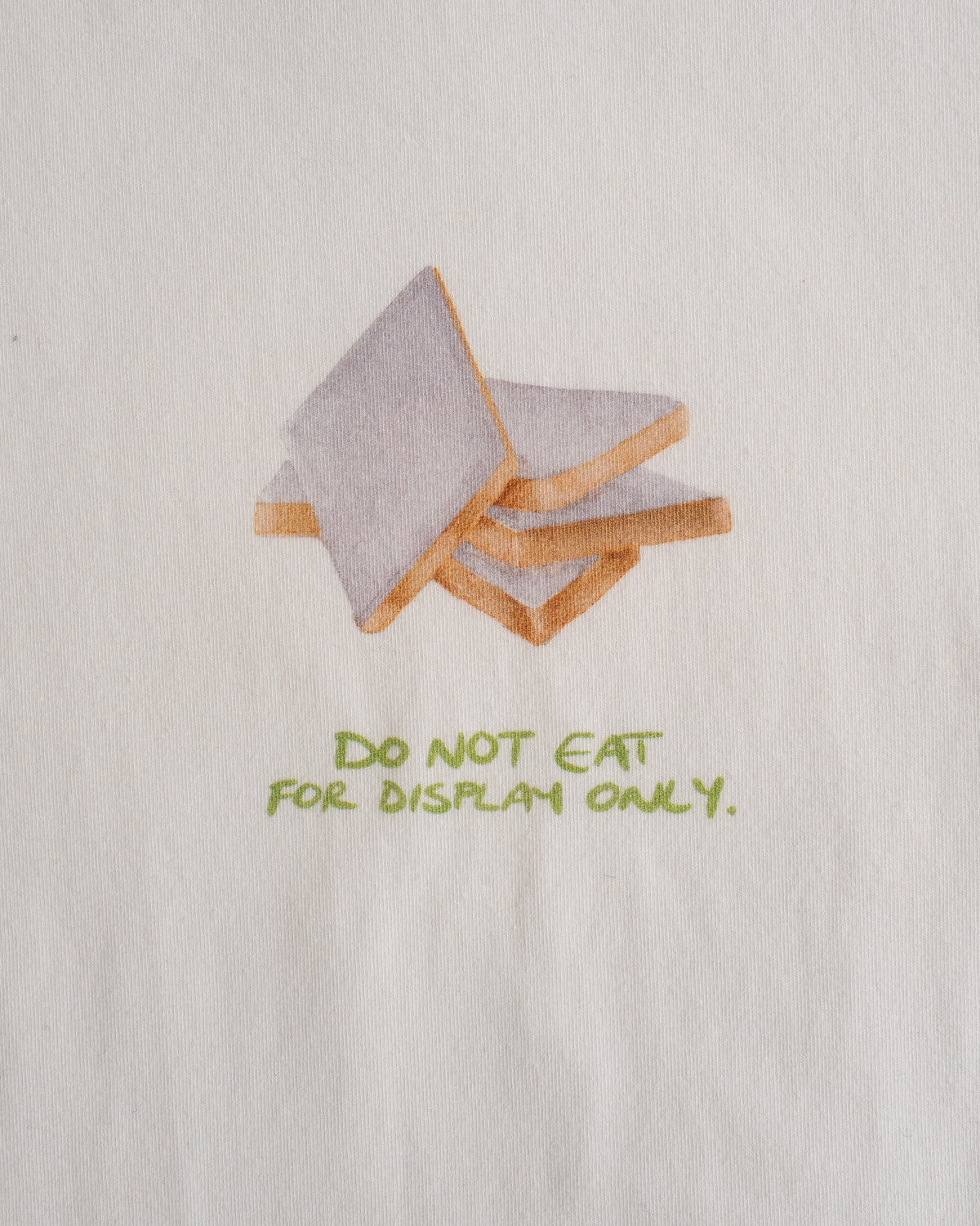 Close-up of the kaju katli print and the line: do not eat, for display only #Color_Kaju Katli
