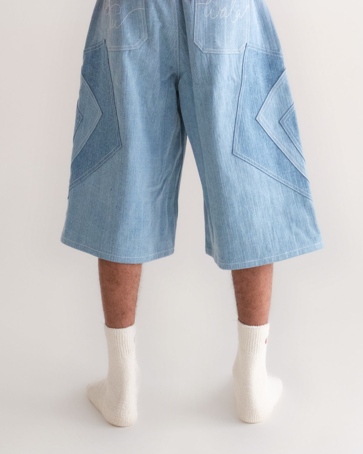 Khadi Katli Jorts on model from behind, patchwork panels and back pockets