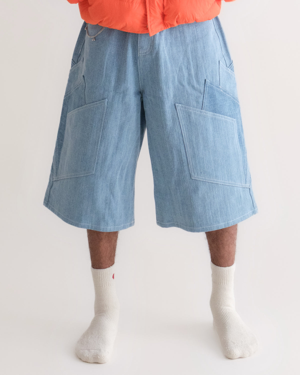 Khadi Katli Jorts on model, front view, streaky khadi denim with patchwork panels, worn with the Jalebi Down Jacket