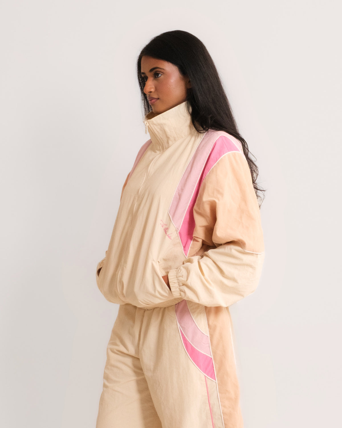 Side view of the Rose Pink Sweets Track Jacket and Track Pants, drop shoulder and a baggy barrel leg #Color_Rose Pink