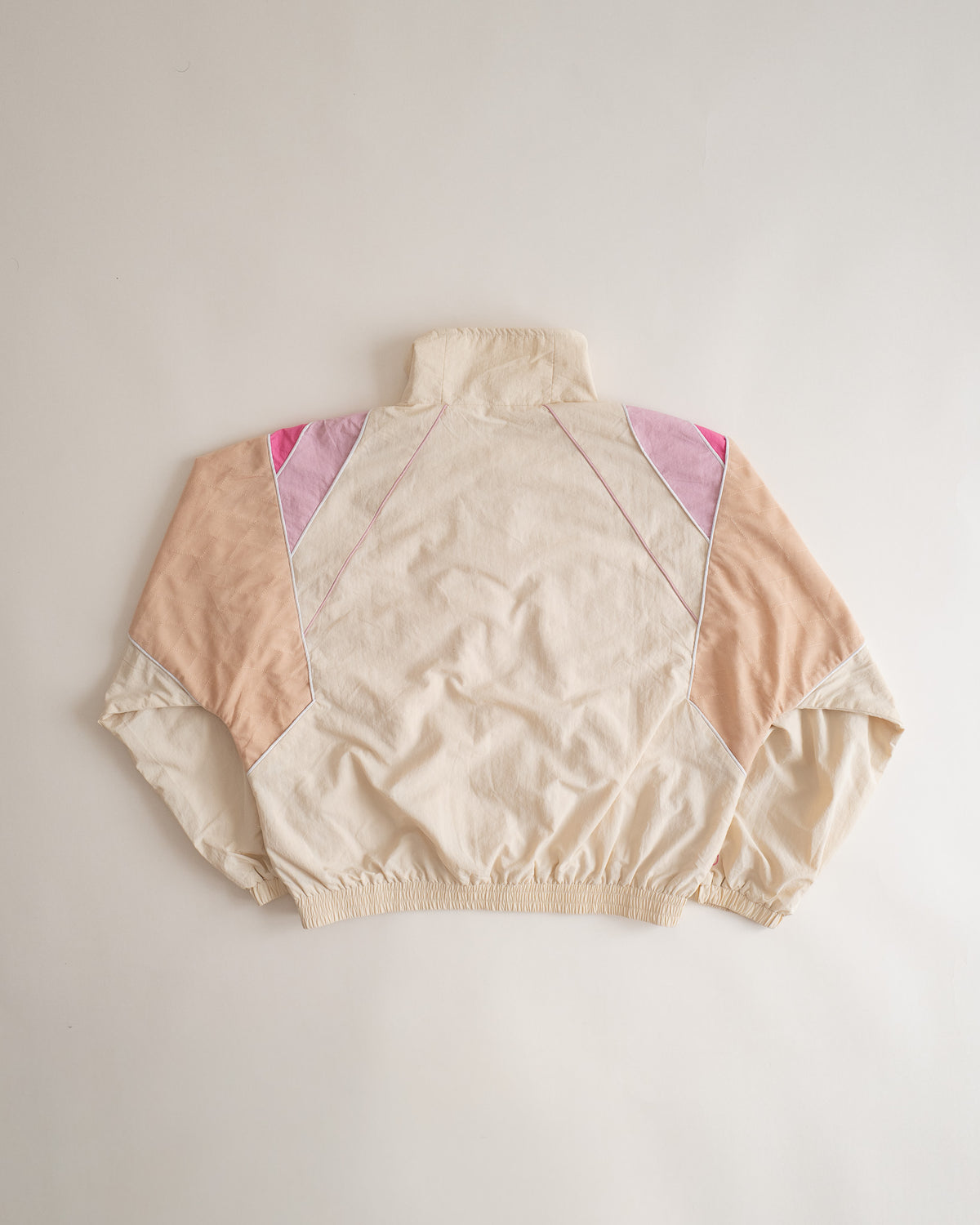 Sweets Track Jacket in Rose Pink, flat lay from the back #Color_Rose Pink