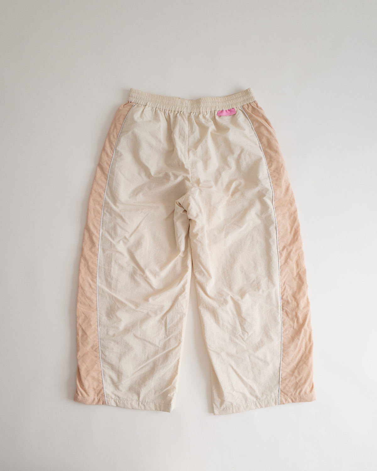 Sweets Track Pants in Rose Pink, flat lay from the back #Color_Rose Pink