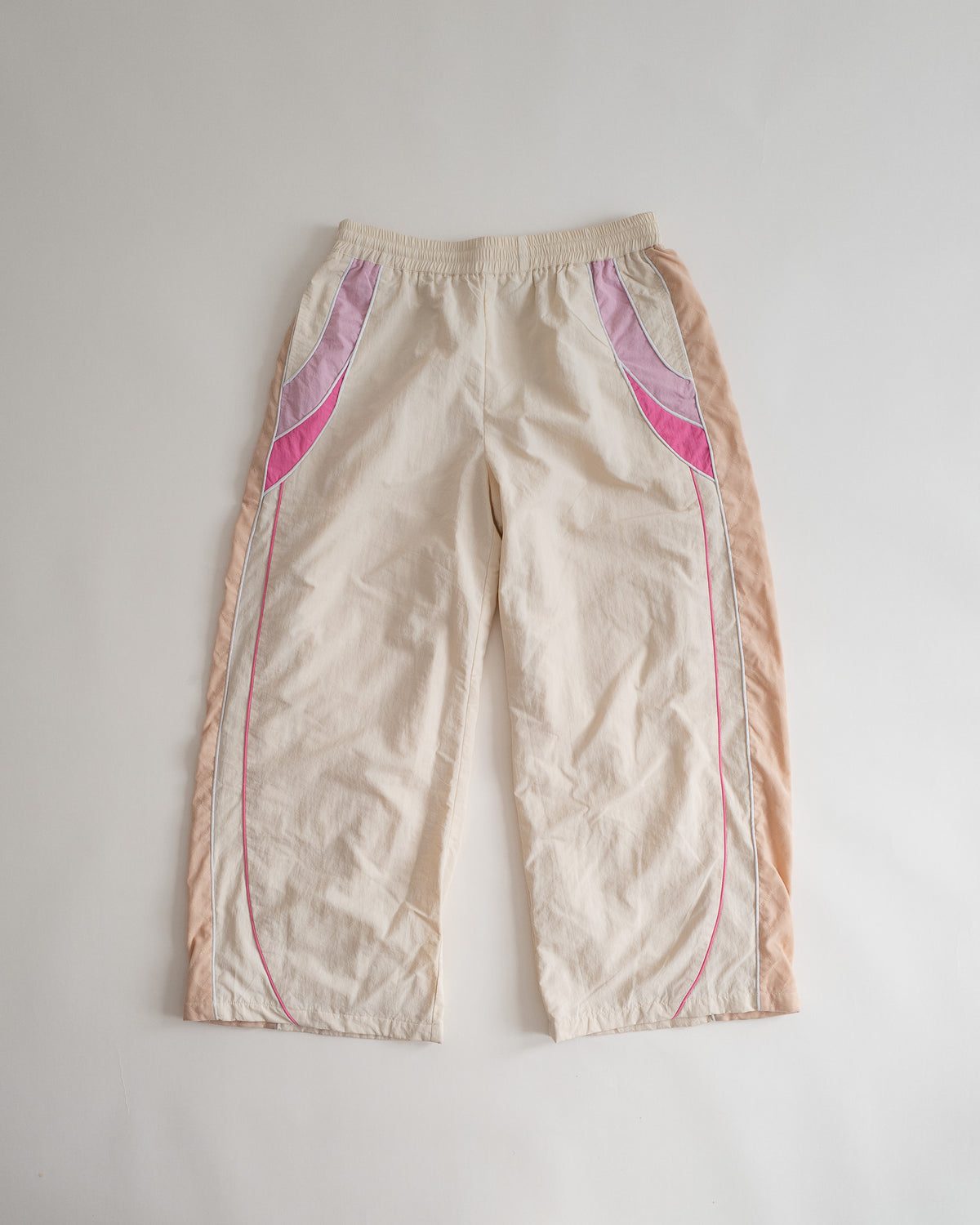 Sweets Track Pants in Rose Pink, flat lay from the front #Color_Rose Pink