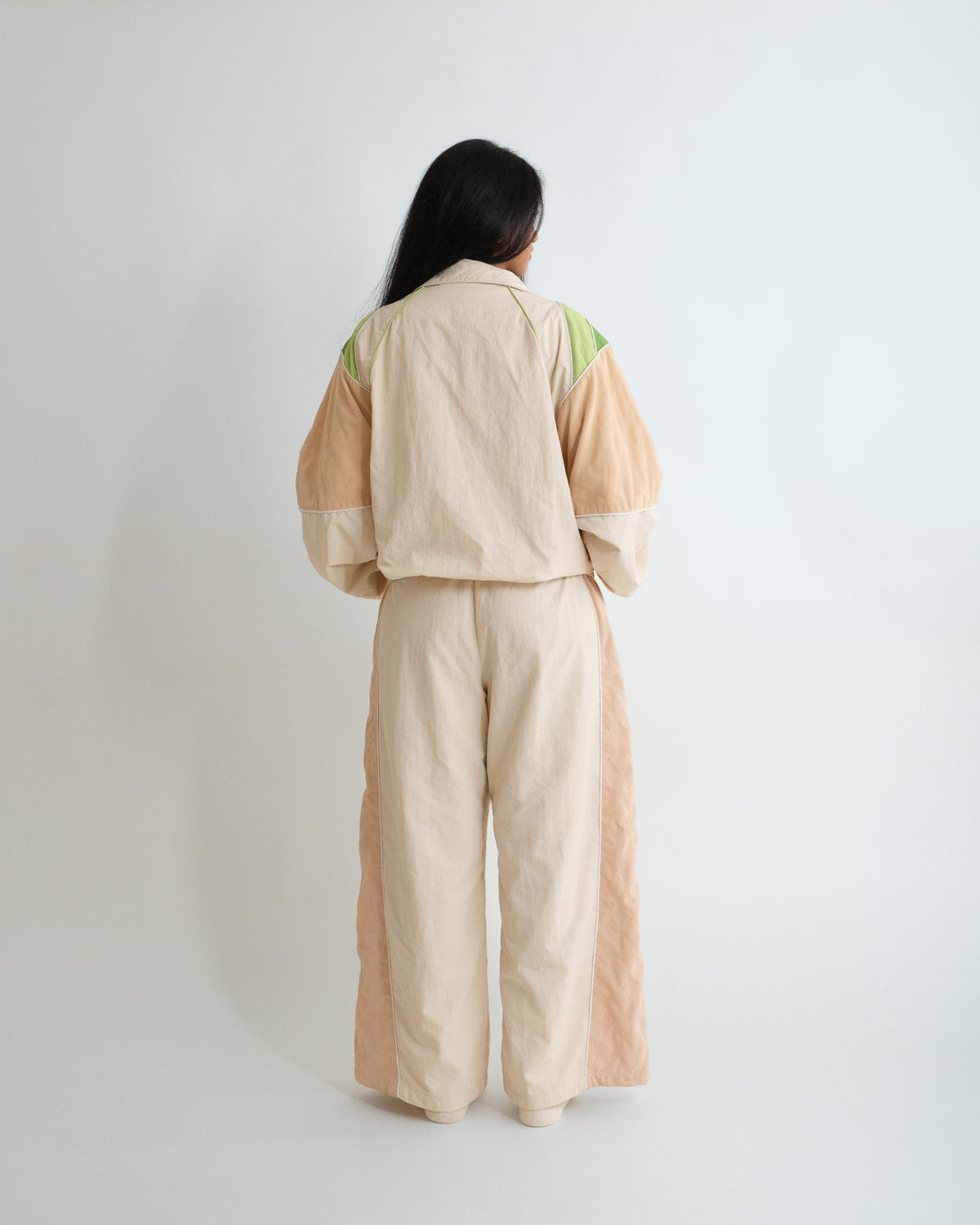Woman from behind in the Pista Green Sweets Track Jacket and Track Pants #Color_Pista Green