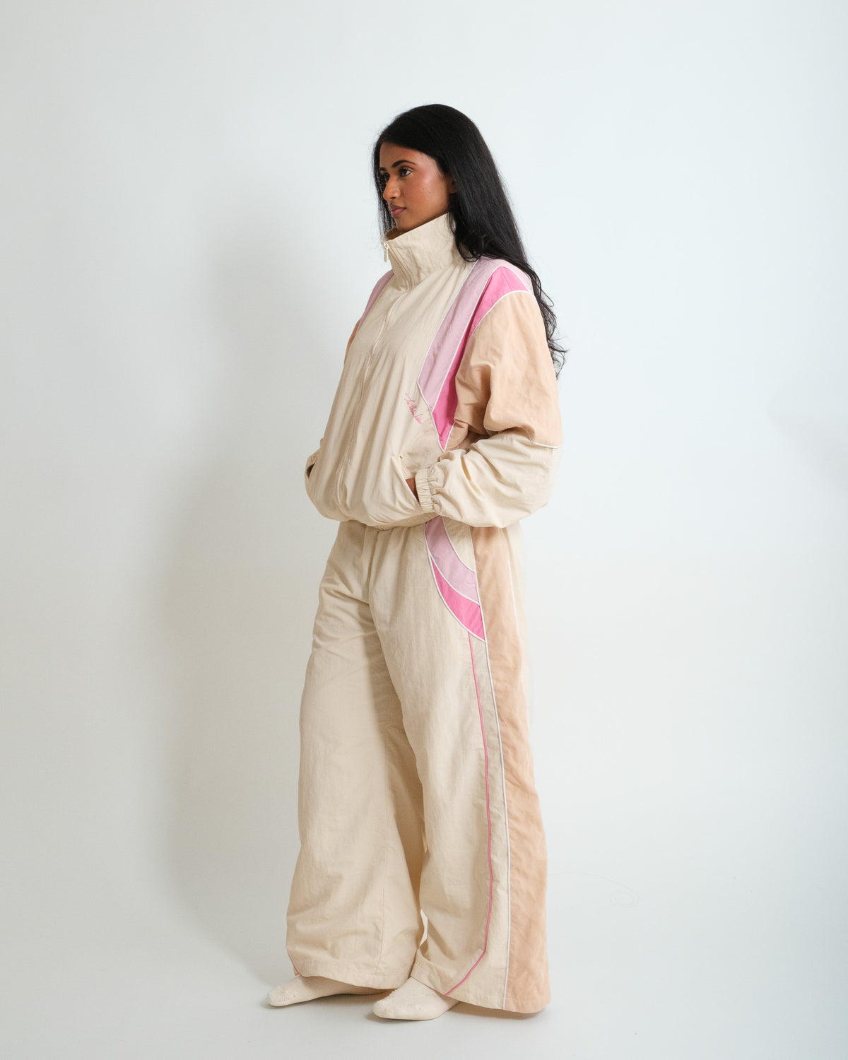 Side view of the Rose Pink Sweets Track Jacket and Track Pants, drop shoulder and a baggy barrel leg #Color_Rose Pink